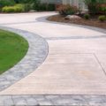 Refinished concrete driveway with custom inlay stamping